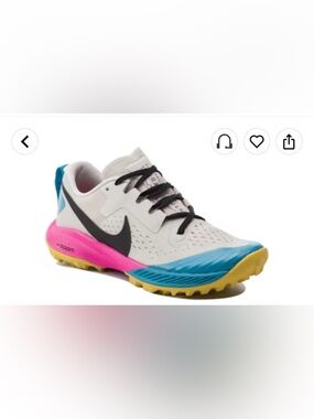 Nike White Athletic Shoe with Black Swoosh and Multicolor Sole